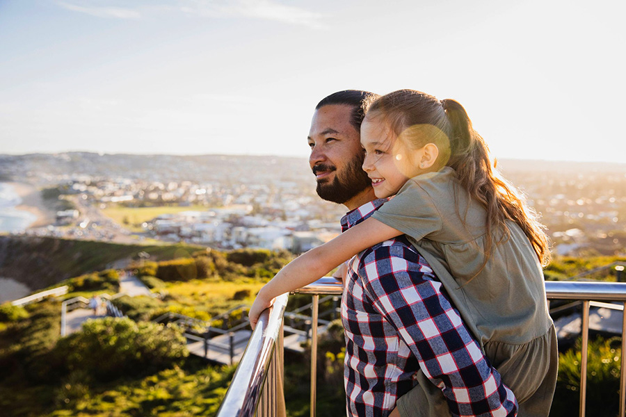 Father and daughter enjoying a walk along the Newcastle Memorial Walk, The Hill. Credit: Destination NSW