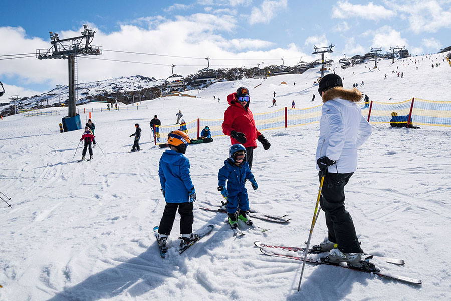 People snowboard and ski at Perisher Ski Resort, NSW. Credit: NSW Department of Planning, Housing and Infrastructure / Jaime Plaza Van Roon